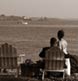 On the Maine coast, lighthouse, lobster boat and the happy couple!