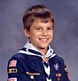 Boy shows his pride in being a Cub Scout