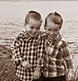 Twin boys in a sepia-toned portrait.