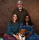 A family of three with their dog.