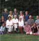 An extended family at their home by the garden