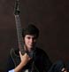 A split lighting portrait in our Brunswick studio, using his guitar as a prop.