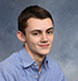 An indoor studio portrait.