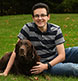 A young man with his dog.