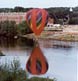 A balloon over the Androscoggin River during the Great Falls Balloon Festival